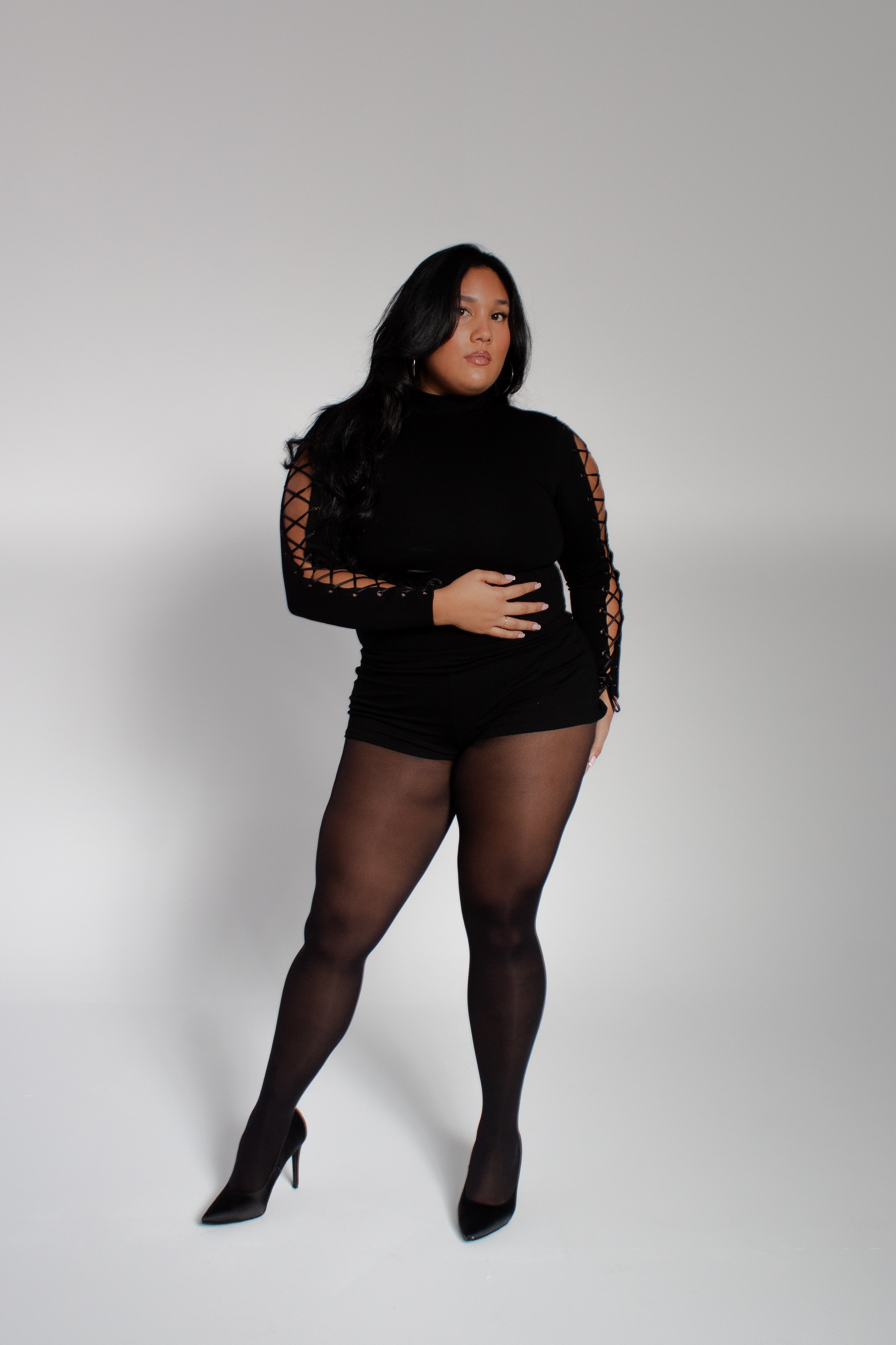 Model wearing mariposa bodysuit on a white background