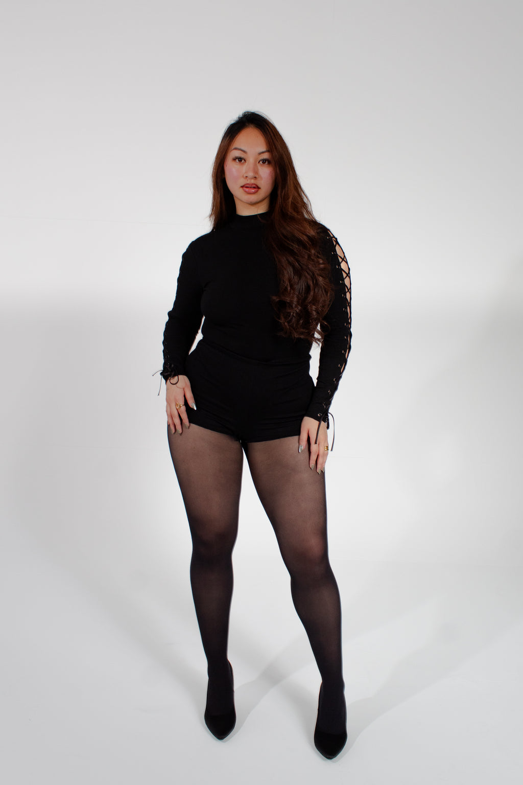 Model wearing mariposa bodysuit on a white background