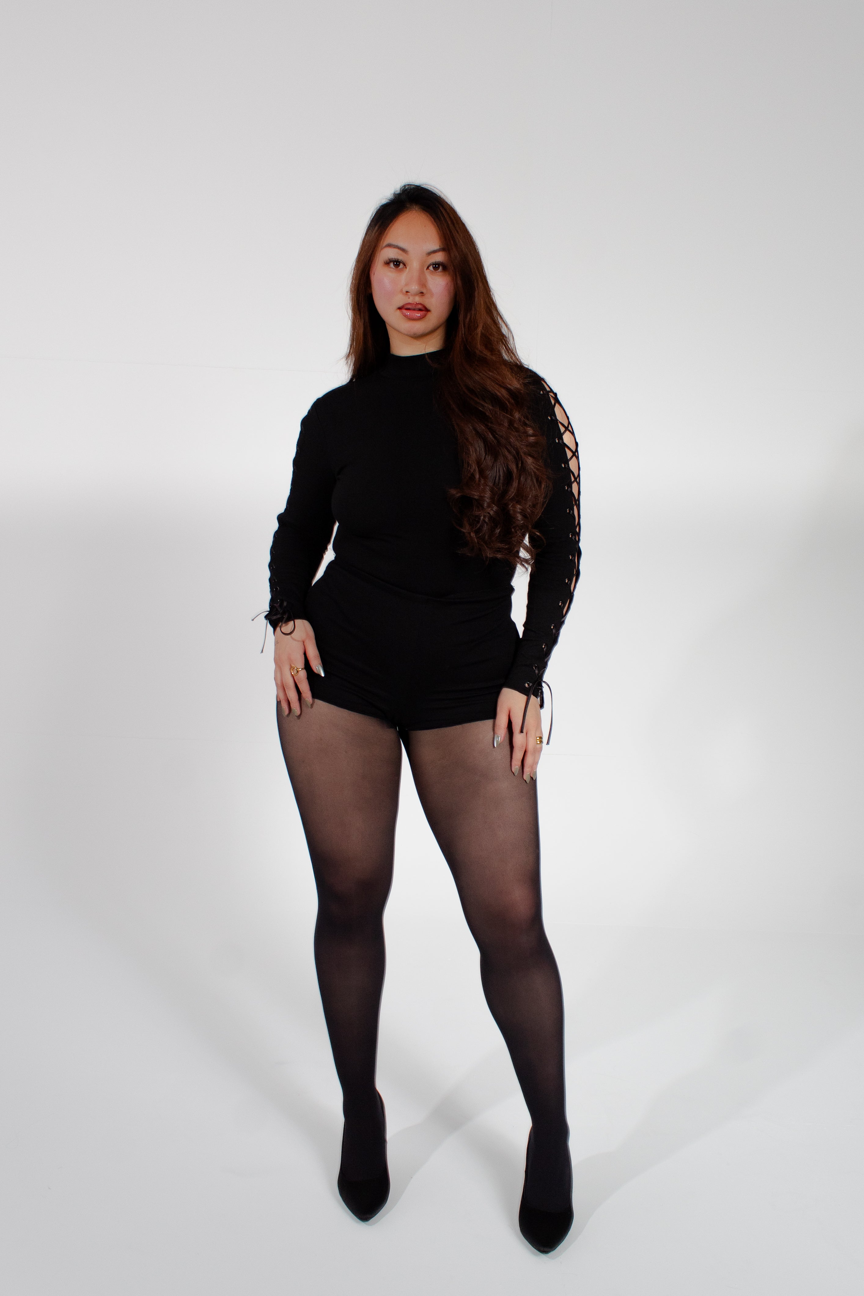 Model wearing mariposa bodysuit on a white background