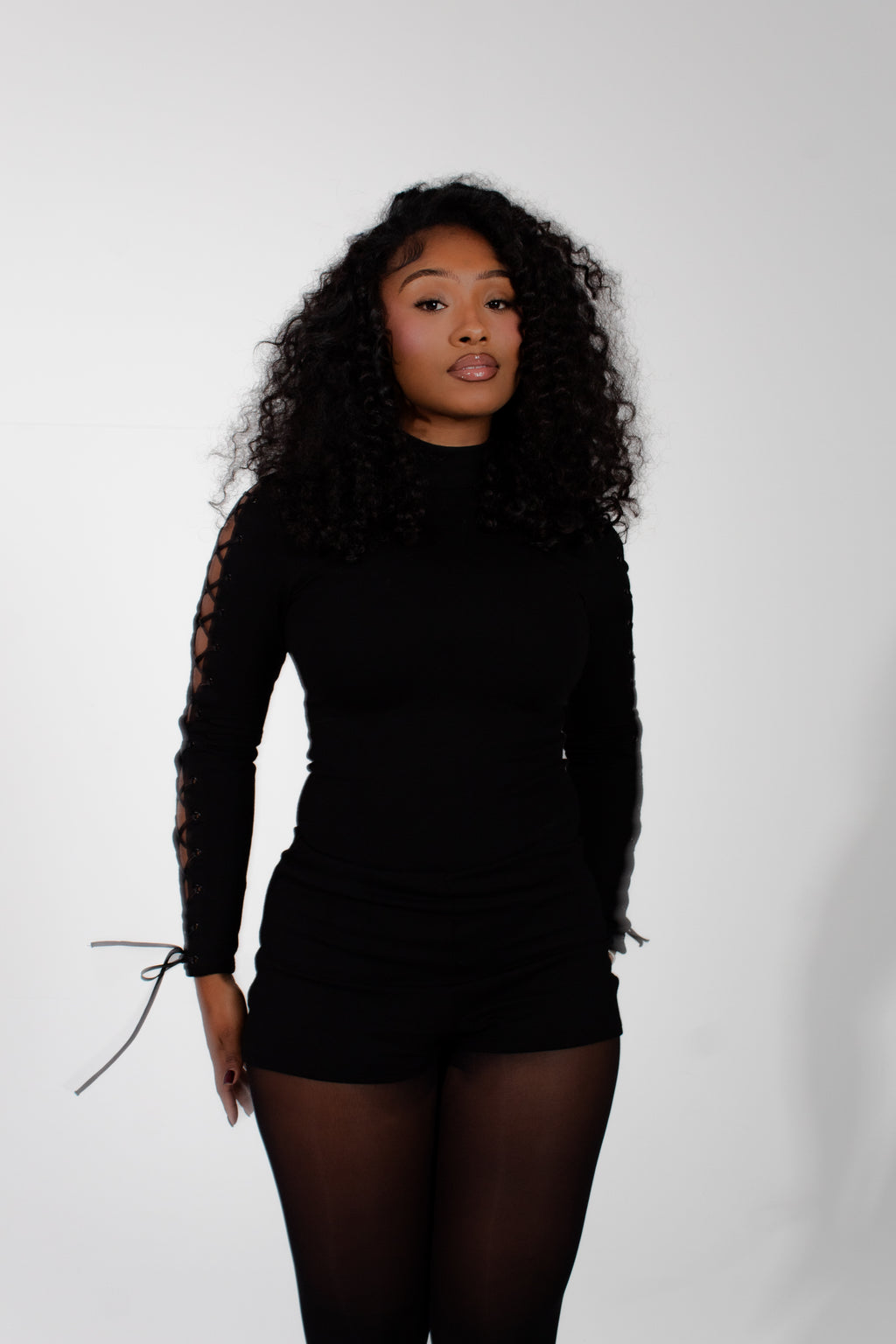 Model wearing mariposa bodysuit on a white background