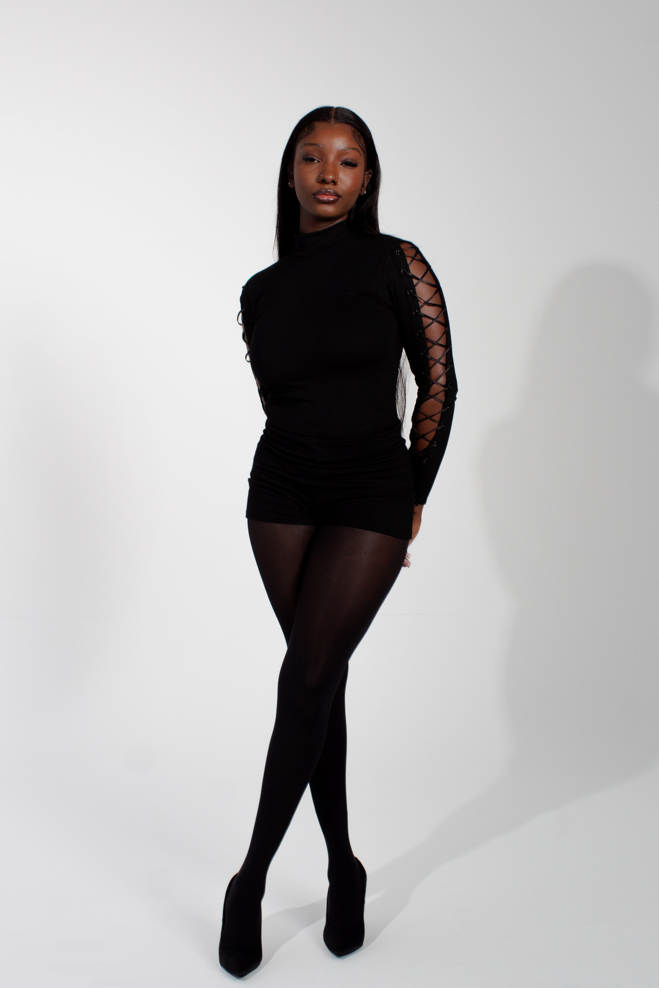 Model wearing mariposa bodysuit on a white background