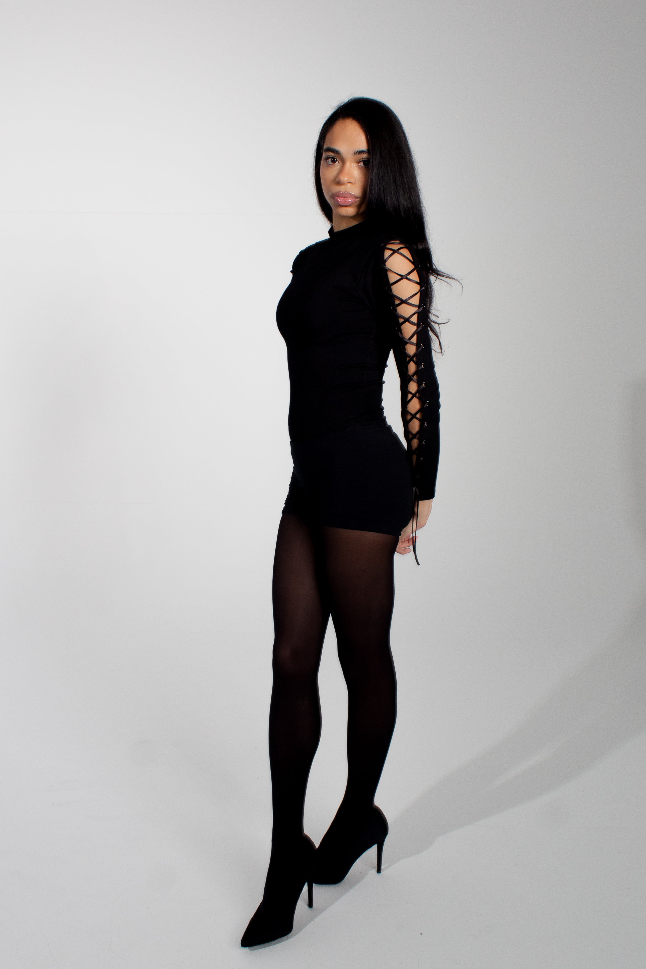 Model wearing mariposa bodysuit on a white background